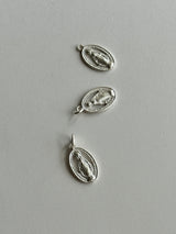 the Virgin Mary medai top