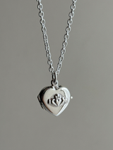 Hands wrapped around a heart Design Locket Pendant top
