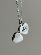 Hands wrapped around a heart Design Locket Pendant top