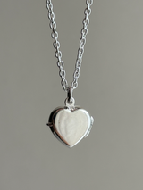 Hands wrapped around a heart Design Locket Pendant top