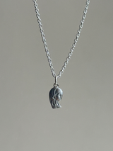 the Virgin Mary charm