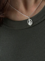 the Virgin Mary medai top