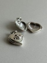 Hands wrapped around a heart Design Locket Pendant top