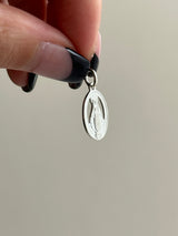 the Virgin Mary medai top