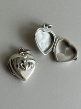 Hands wrapped around a heart Design Locket Pendant top